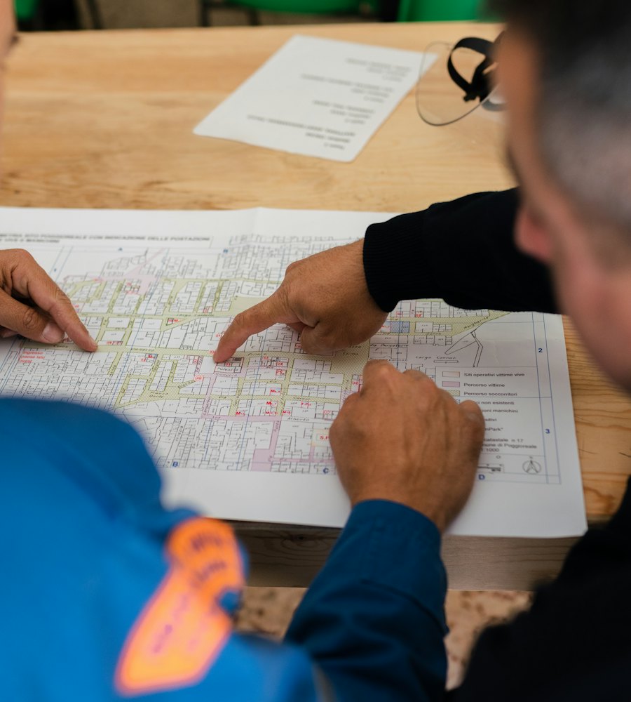 Two engineers reviewing a technical drawing together